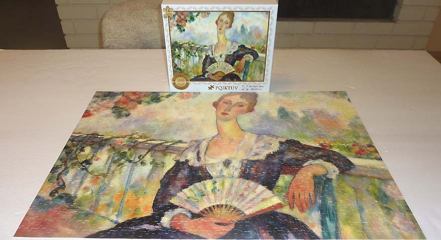 Woman Holding a Fan